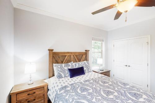 a bedroom with a bed and a ceiling fan at Townsend Timbers in Townsend