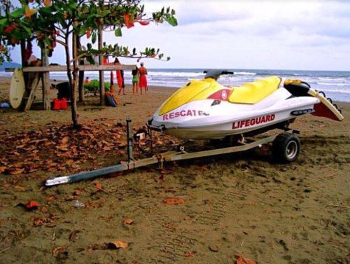 a boat on a trailer on the beach at Domi cabin small in Dominical
