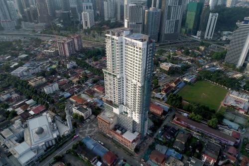 an aerial view of a tall building in a city at Tamu Hotel & Suites Kuala Lumpur in Kuala Lumpur