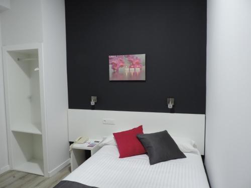 Postel nebo postele na pokoji v ubytování Hotel Junquera