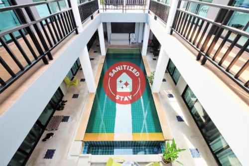 an overhead view of a swimming pool in a building at Tina Boutique Resort in Thalang