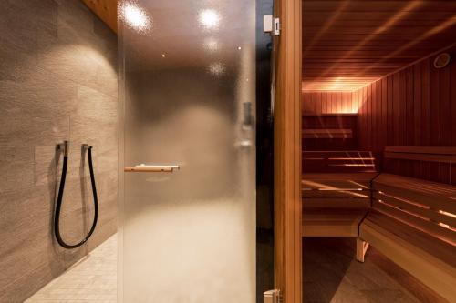 a shower stall in a bathroom with a showeriterator at Apart6580 in Sankt Anton am Arlberg