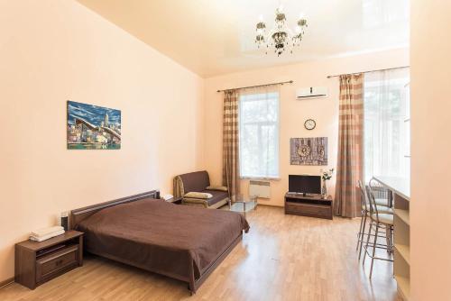 Postel nebo postele na pokoji v ubytování Apartments Etazh
