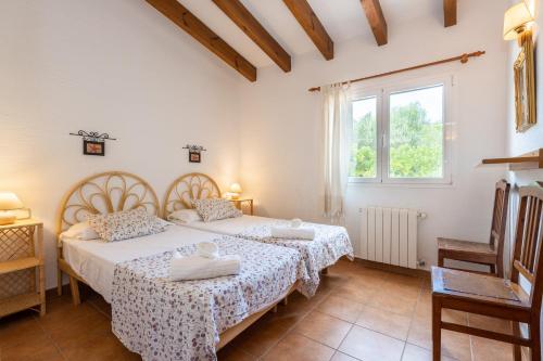 מיטה או מיטות בחדר ב-Villa Alcaufar