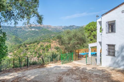 a house with a view of a mountain at Casa Rural Monte Dios in Jubrique