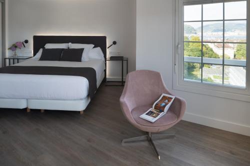 Cama o camas de una habitación en Hotel Avenida
