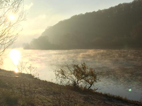 a body of water with the sun shining on it at Wanderer Paradies in Pirna