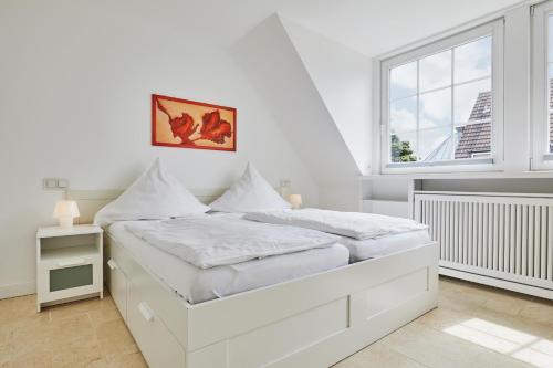 Een bed of bedden in een kamer bij Neue Liebe