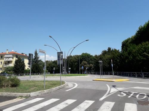 an empty street with street lights on a road at Solare B&B in Mestre