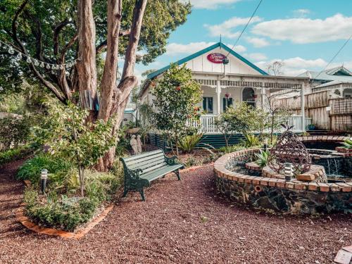 a park bench sitting in front of a house at Genesta House in Cowes