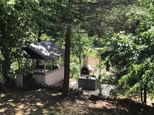 a gazebo in the middle of a yard with trees at Wanderer Paradies in Pirna