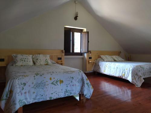 מיטה או מיטות בחדר ב-O Rincón de David