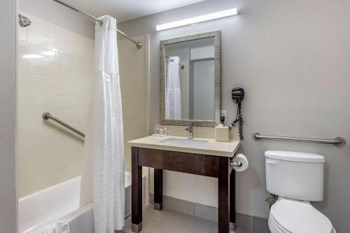a bathroom with a sink and a toilet and a shower at Comfort Inn & Suites North Little Rock JFK Blvd in North Little Rock