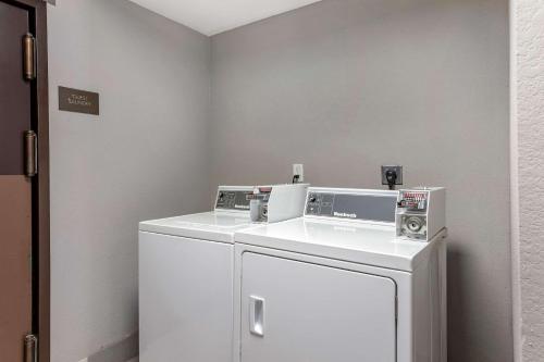 a laundry room with a white washer and dryer at Comfort Inn & Suites North Little Rock JFK Blvd in North Little Rock