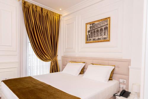 Posteľ alebo postele v izbe v ubytovaní Eler Hotel