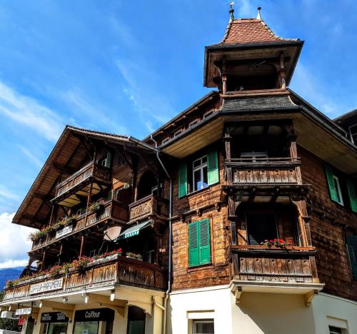 a building with balconies on the side of it at Jobling's Holiday Apartment in Interlaken