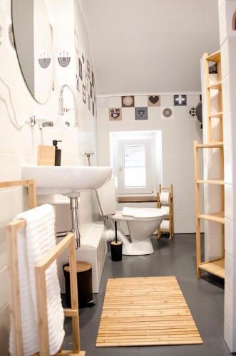 a bathroom with a sink and a toilet at Poziomkowa 5 in Szczyrk