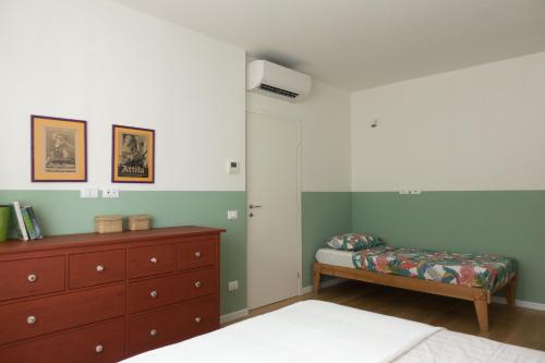 En eller flere senge i et værelse på Da Coco - Apartments