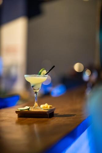 a martini glass with a lime on a table at Majestic Hotel in Oludeniz