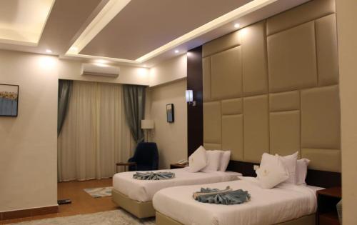 a hotel room with two beds in a room at Royal Jewel Al Raml Hotel in Alexandria
