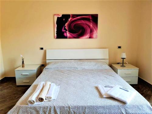 Cama ou camas em um quarto em Guest House Loriano