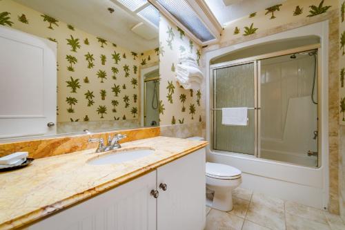 a bathroom with a sink and a toilet at Boca Grande Hotel in Boca Grande