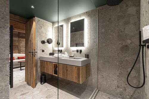 a bathroom with a sink and a shower at Hotel Le Chabichou in Courchevel