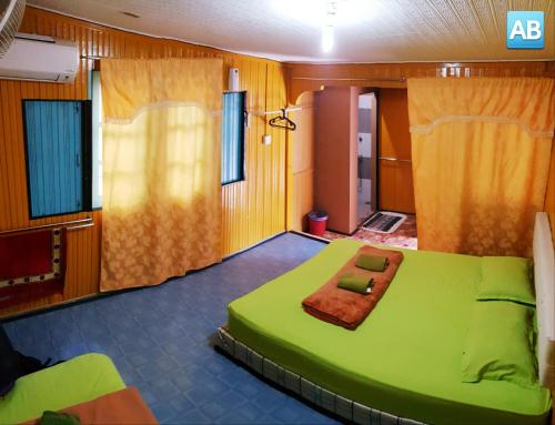 Postel nebo postele na pokoji v ubytování Perhentian AB Guest House