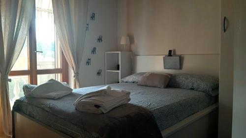 A bed or beds in a room at L'angolo di Betti