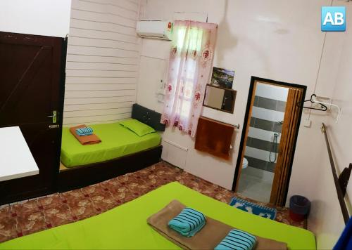 Perhentian AB Guest Houseにあるベッド