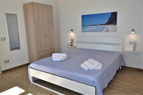 Posteľ alebo postele v izbe v ubytovaní Casa Vacanze Monte Cofano