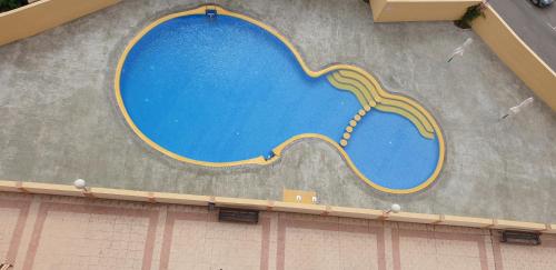 an overhead view of a swimming pool on a building at FMM Apartamentos Costa Blanca Playa DOS HABITACIONES in Benidorm