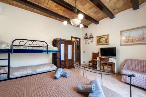 a room with two bunk beds and a living room at Kyterion Apartment in Rome