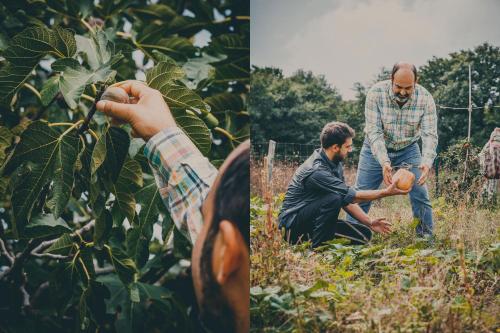 two men in a field with a man holding a pumpkin at Agriturismo Buonasera in Bagnoregio