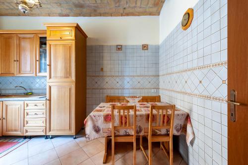 a kitchen with a table and two chairs at Kyterion Apartment in Rome