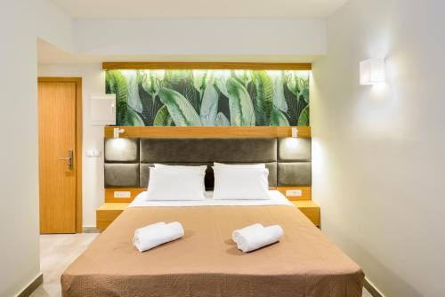 Ένα ή περισσότερα κρεβάτια σε δωμάτιο στο Elia Kalamaki Hotel