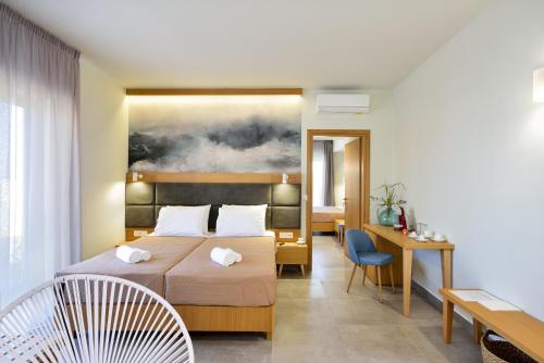 Voodi või voodid majutusasutuse Elia Kalamaki Hotel toas