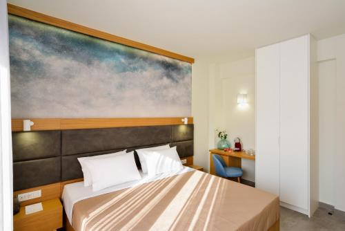 Ένα ή περισσότερα κρεβάτια σε δωμάτιο στο Elia Kalamaki Hotel