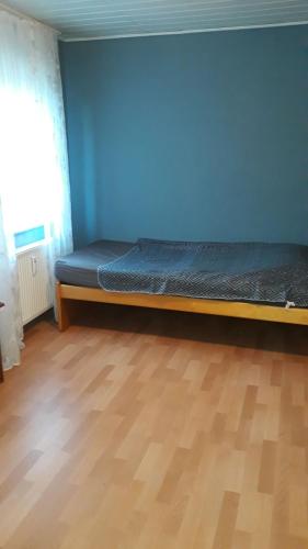 Кровать или кровати в номере Melle Ferienwohnung