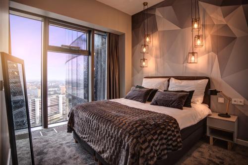 Postel nebo postele na pokoji v ubytování Apartamenty Sky Tower
