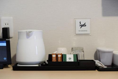 a counter with a blender and other items on it at The Light Inn - Vacation STAY 94706 in Tokyo