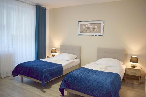 Postel nebo postele na pokoji v ubytování H2U LUX Hostel Dla Ciebie