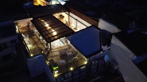 an overhead view of a house with a blue roof at night at Casa Amanzi Cartagena by Bernalo Hotels in Cartagena de Indias