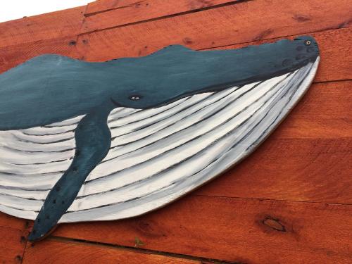a bird painted on the side of a building at Posada Agua Marina in La Paloma