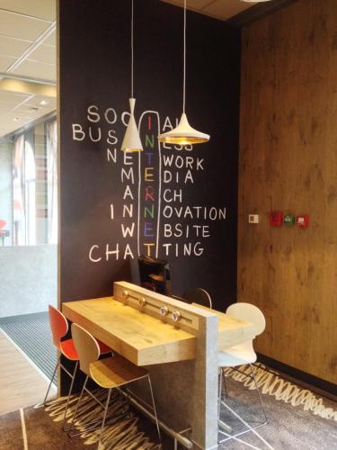 a conference room with a table and chairs at Ibis Agen Centre Gare in Agen