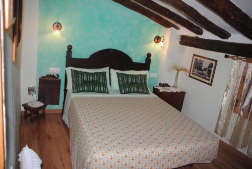 Tempat tidur dalam kamar di Casa Rural Casa Puntes