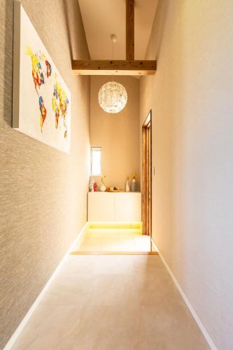 a hallway of a home with a light fixture at UmiToSora Ishigakijima in Ishigaki Island