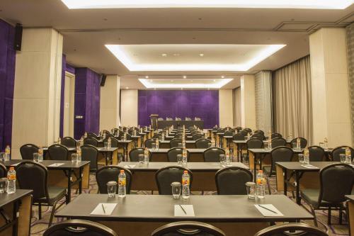 a large room with tables and chairs in it at Swiss-Belinn Cikarang in Cikarang