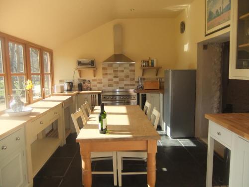 A kitchen or kitchenette at Baddegai Holiday Cottage 