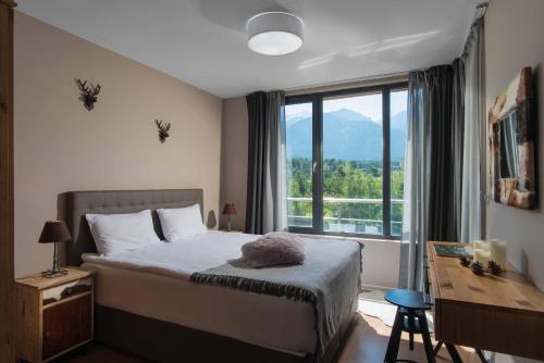 Postel nebo postele na pokoji v ubytování Cornelia Deluxe Residence